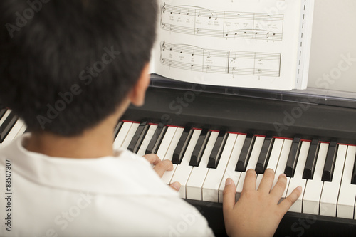 piano lesson, Asian boy kid activity playing piano with notes