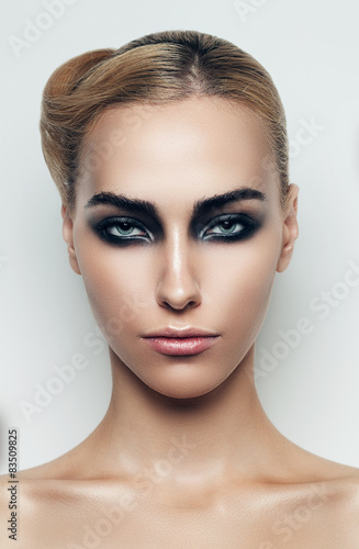 blond woman with black eyeshadows