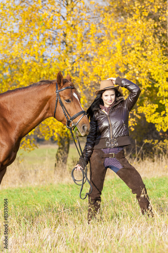 equestrian with her horse in autumnal nature © Richard Semik