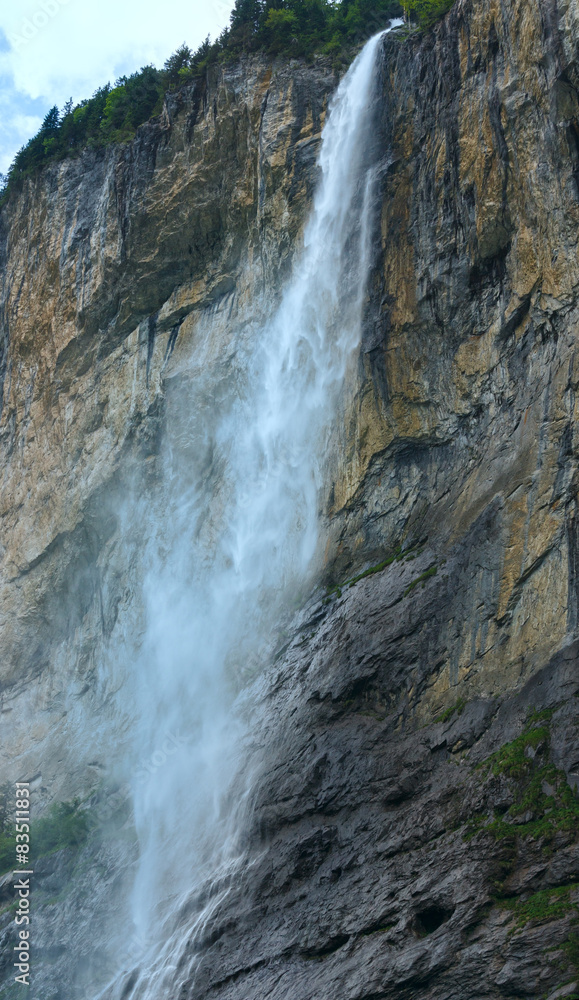 Waterfall in summer mountain