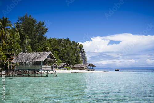 Konstfotografi Water bungalows at west side of Kri Island in Raja Ampat