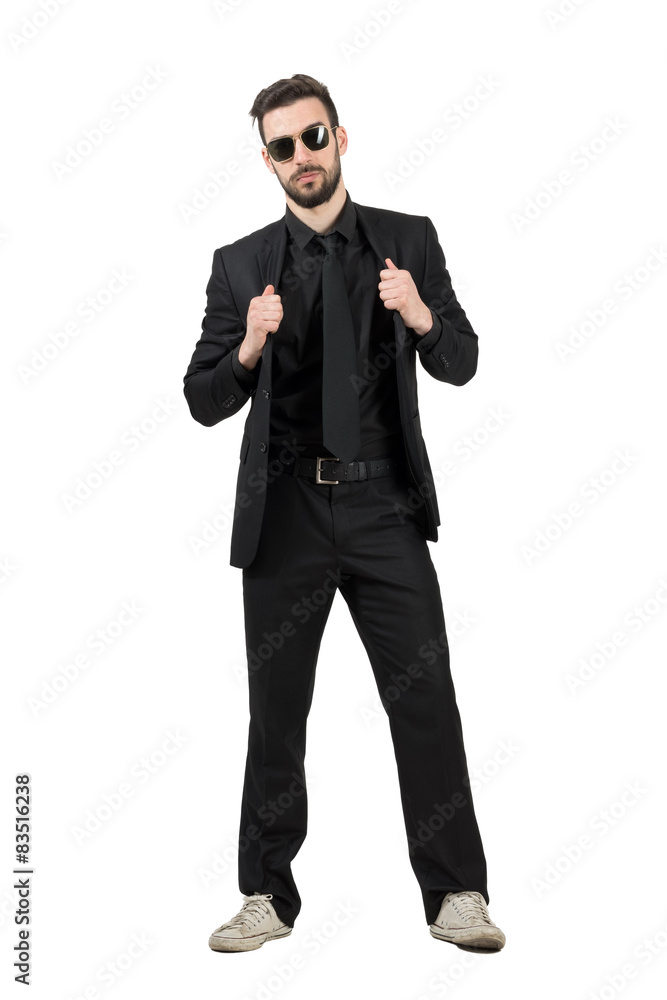Mysterious man in business suit and white sneakers Mysterious man in business suit and white sneakers