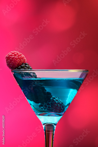 Colorful cocktails garnished with berries photo