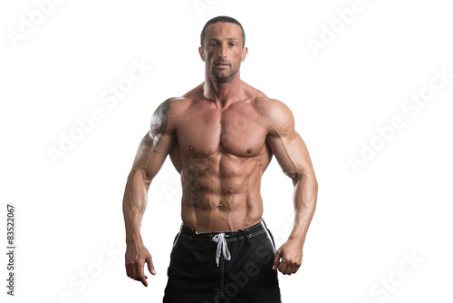 Muscular Bodybuilder Man Posing Over White Background