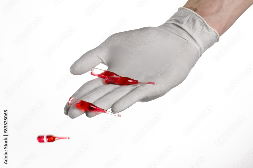 Doctor hand holding a vial, ampule red, vaccine ampule
