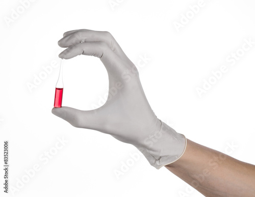 Doctor hand holding a vial, ampule red, vaccine ampule