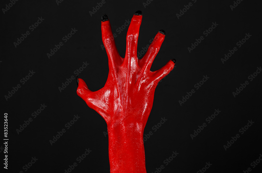 Red Devil's hands, red hands of Satan, black background isolated Red Devil's hands, red hands of Satan, black background isolated