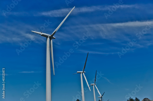 group of windmills for renewable electric energy production © marsone