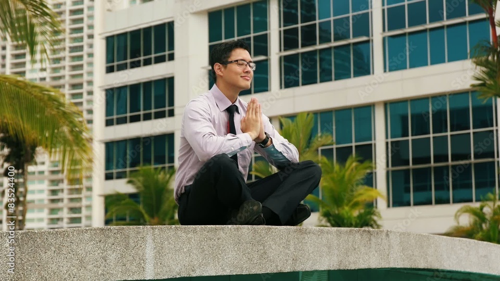 Chinese Businessman Meditating Yoga Outside Office Chinese Businessman Meditating Yoga Outside Office