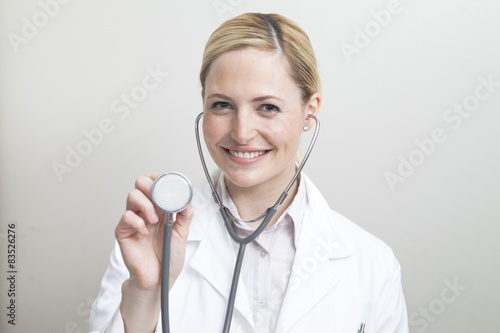 Portrait of female doctor with stethoscope photo