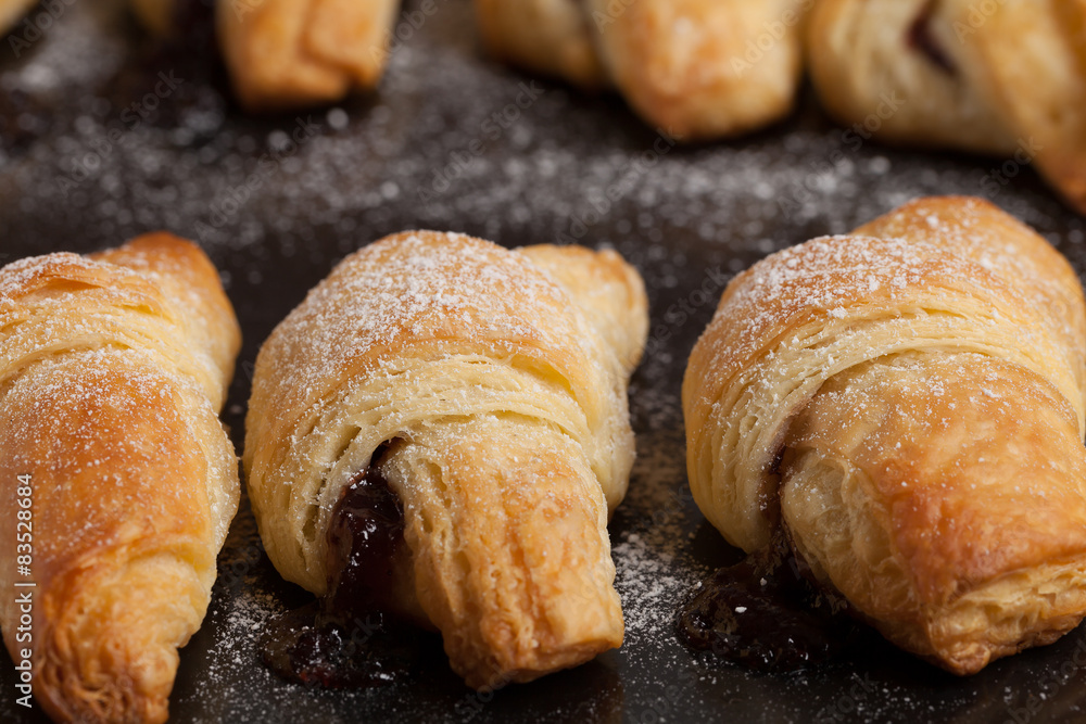 Fresh butter croissants with plum filling.