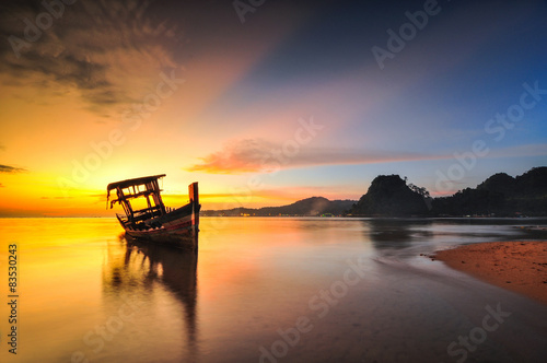 Cambodia, View of tongkang on sea at sunrise photo