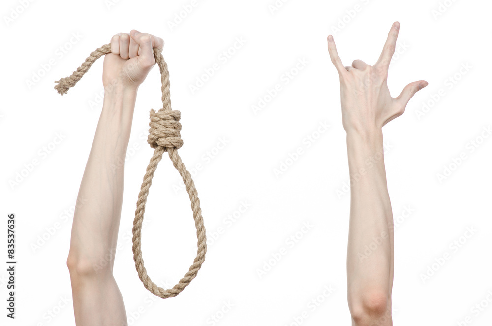 man's hand holding a loop of rope for hanging on isolated man's hand holding a loop of rope for hanging on isolated