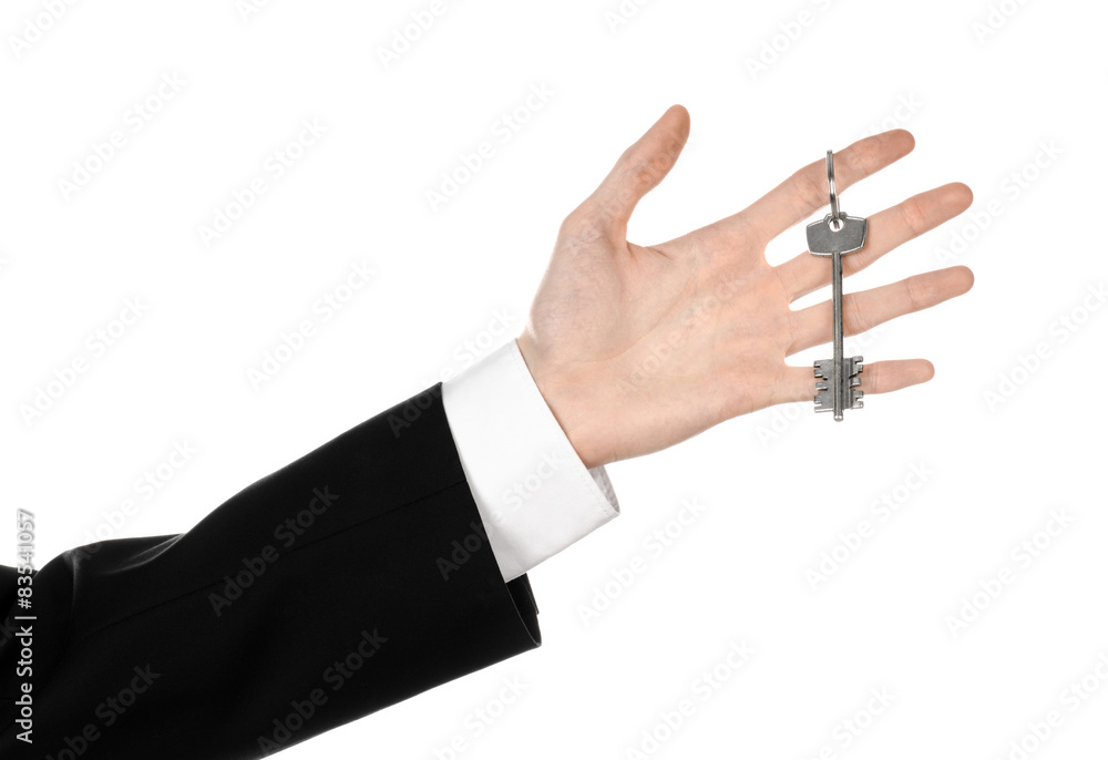 real estate agent in his hand the key to a new apartment real estate agent in his hand the key to a new apartment