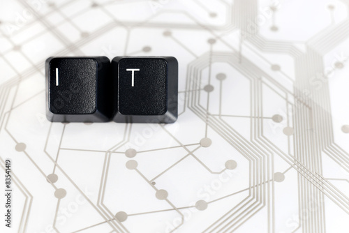 IT, Two Keyboard keys with letters I and T on Circuit Board