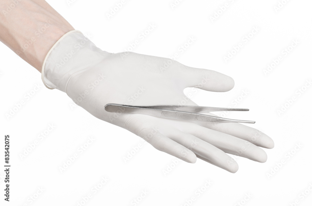 doctor's hand in a white glove holding tweezers isolated studio doctor's hand in a white glove holding tweezers isolated studio