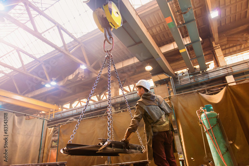 Fotografía Young man in a factory preparing equipment for welding.