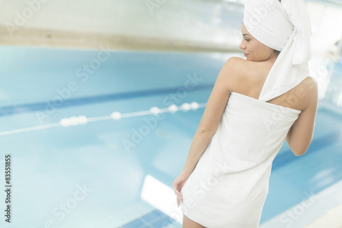 Young woman by the pool