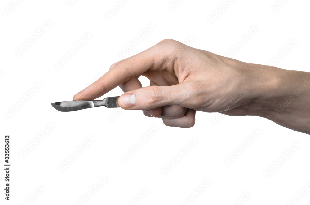 The hand holding the scalpel, white background, isolated studio The hand holding the scalpel, white background, isolated studio