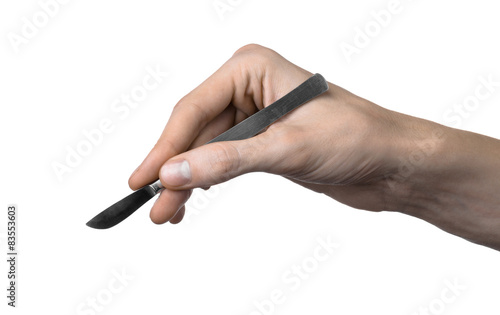 The hand holding the scalpel, white background, isolated studio