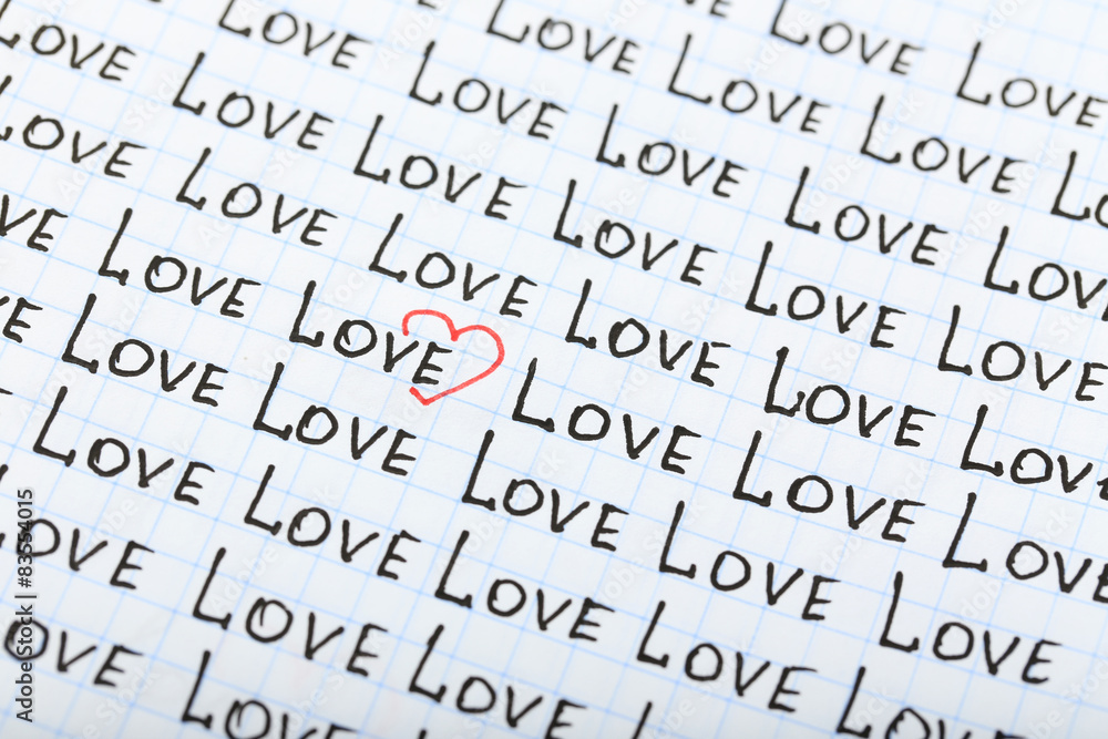 Words LOVE written on sheet of paper background Words LOVE written on sheet of paper background
