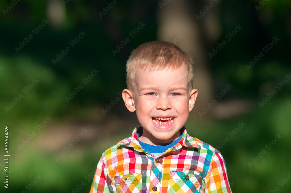 Little boy shouts of joy and face contorts. Little boy shouts of joy and face contorts.