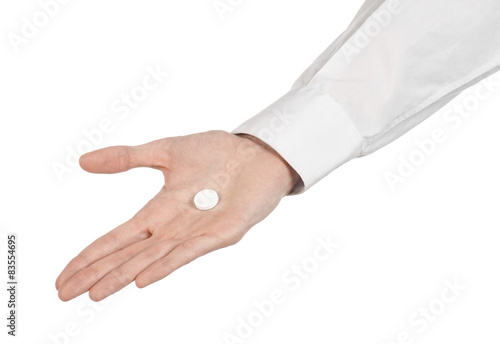 doctor's hand holding a white tablet for health  isolated