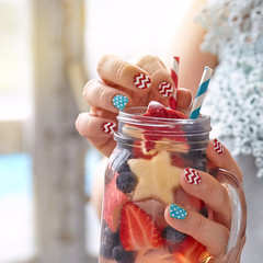 Cocktail with strawberry, blueberry and apple