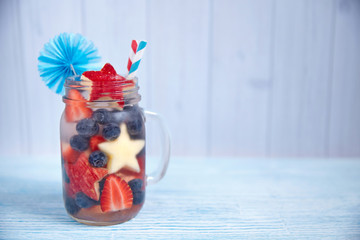 Cocktail with strawberry, blueberry and apple