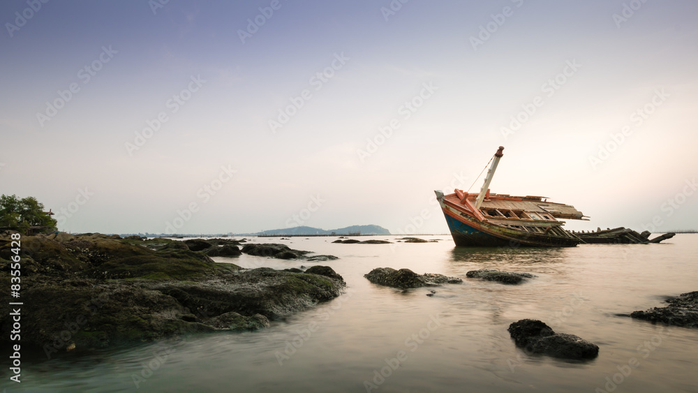 An old fishing boat wreck near the coast.