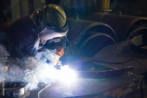 The Welding work during the night with lens flare.
