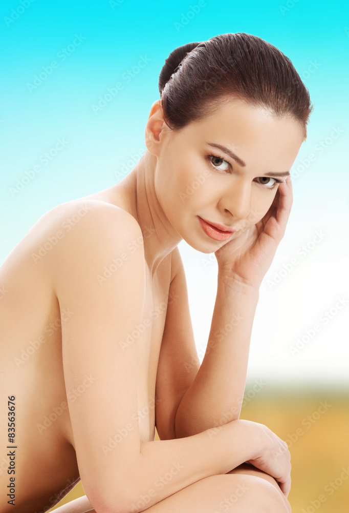 Beautiful spa woman sitting.
