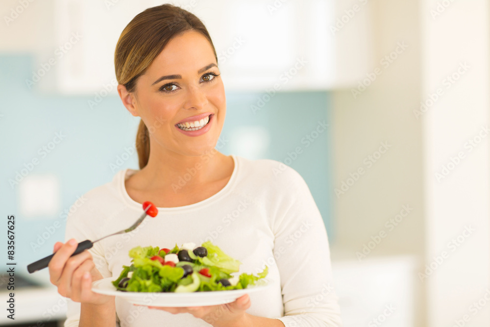 vegetarian eating salad at home