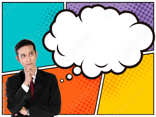 Young businessman looking up to thinking bubble in comic style