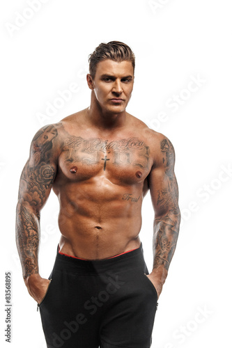 Canvastavla Muscular macho man posing in studio