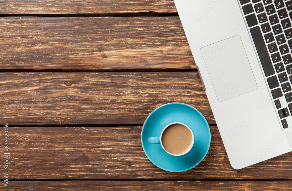 Cup of coffee with laptop computer Cup of coffee with laptop computer