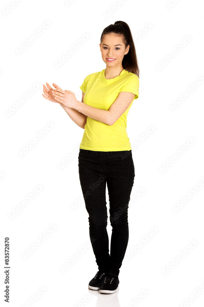 Young happy clapping woman. Young happy clapping woman.