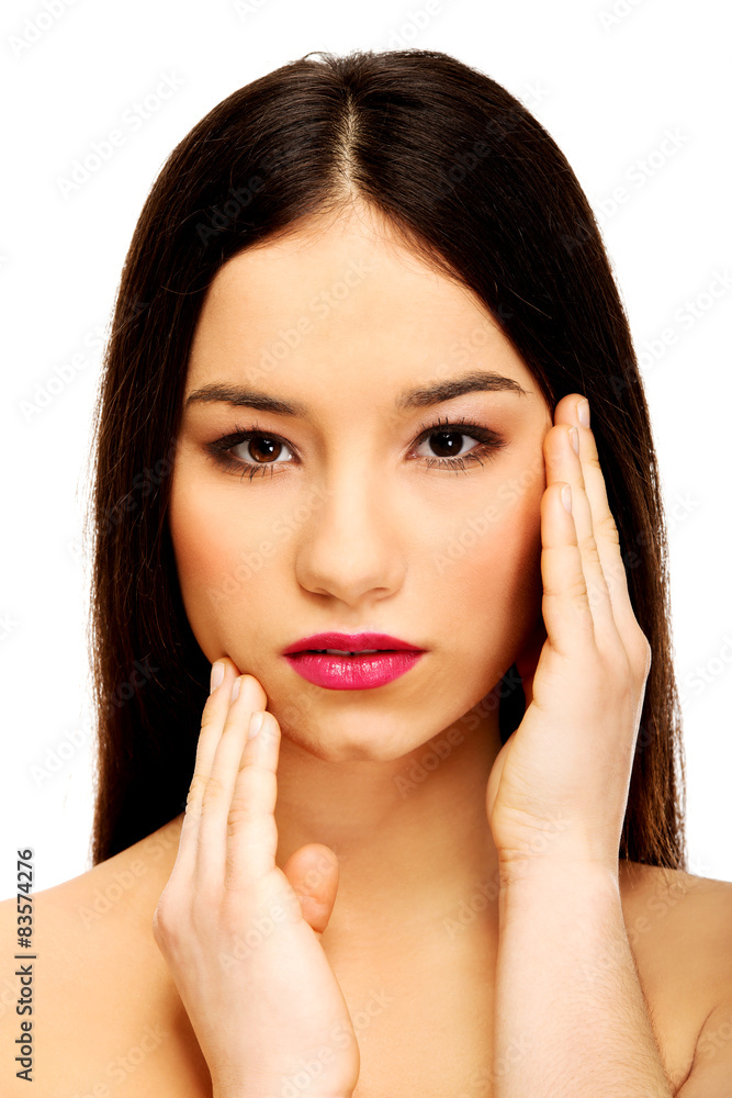 Woman with full make up touching face. Woman with full make up touching face.
