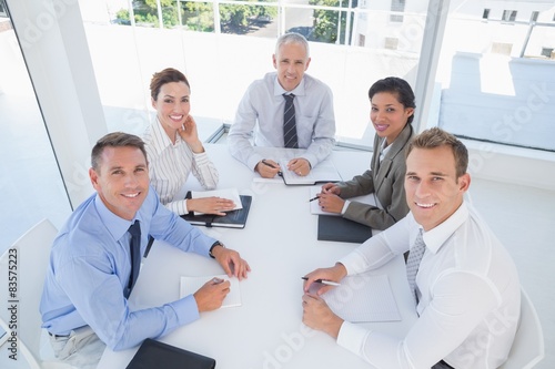 Business team sitting together around the table