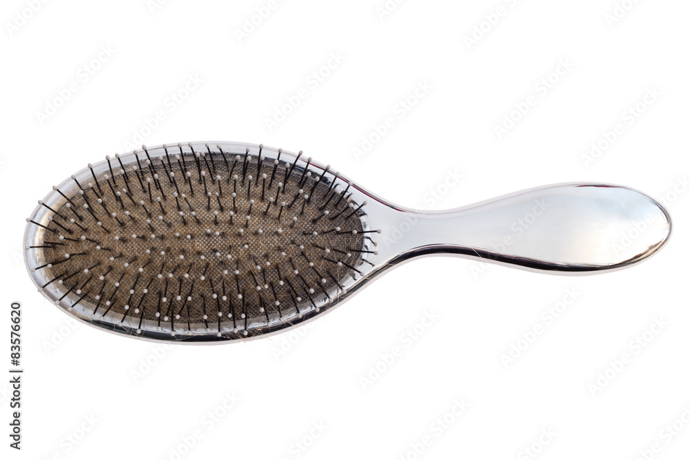 Close-up of an used hairbrush viewed from above, isolated Close-up of an used hairbrush viewed from above, isolated