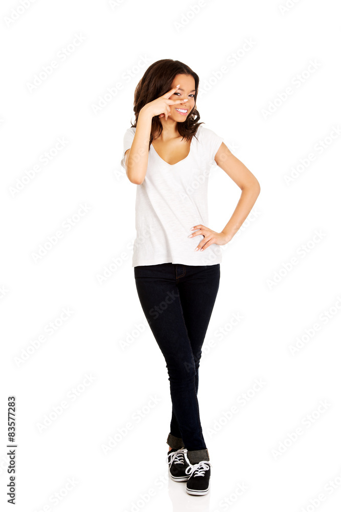 African teenager showing victory sign. African teenager showing victory sign.