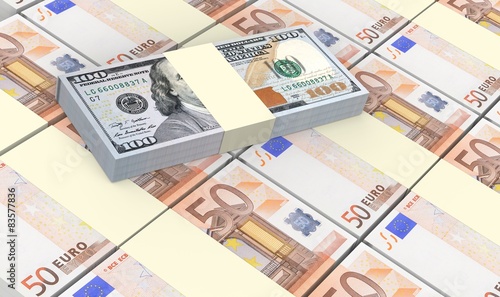 European currency bills stacks with american dollars background.
