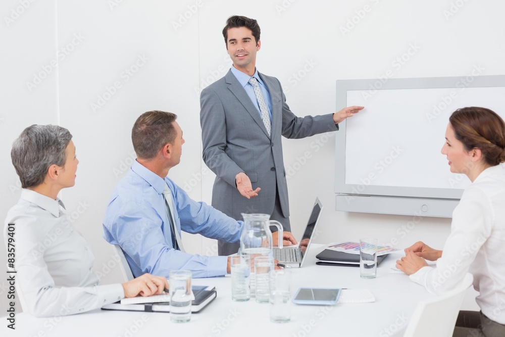 Businessman pointing the white screen Businessman pointing the white screen