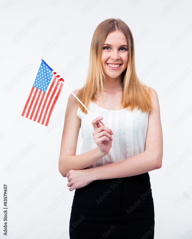 Happy young businesswoman standing with US flag Happy young businesswoman standing with US flag