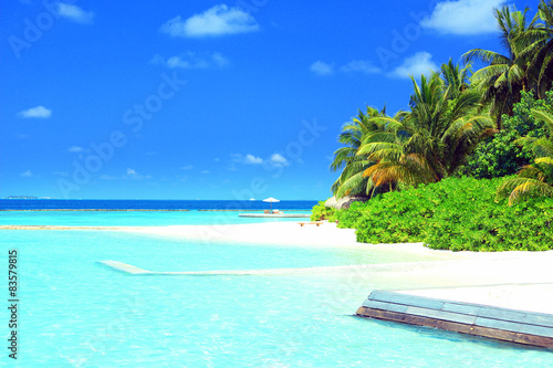 Fototapeta Naklejka Na Ścianę i Meble -  Beautiful view of beach of tropical island on blue sky background