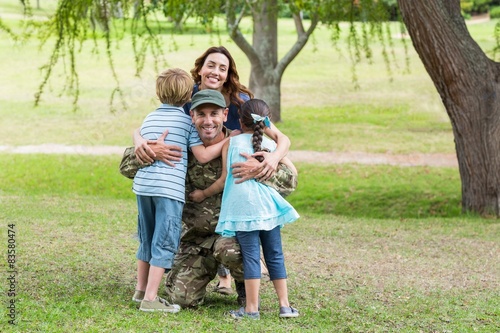 Handsome soldier reunited with family  © WavebreakMediaMicro