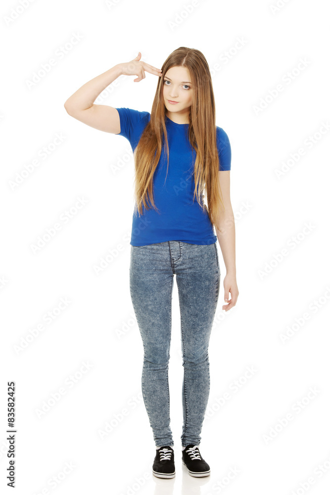 Despair teenage woman making gun sign. Despair teenage woman making gun sign.