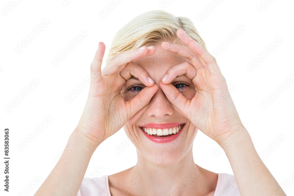 Smiling blonde woman doing funny face Smiling blonde woman doing funny face