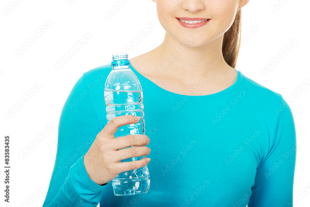 Beautiful woman with bottle of mineral water. Beautiful woman with bottle of mineral water.