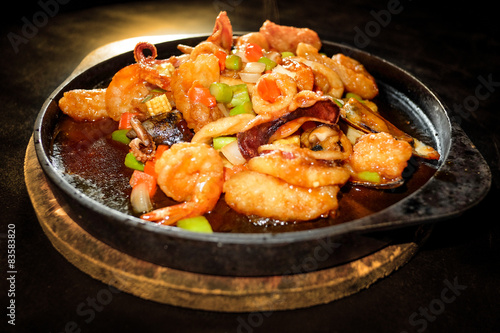 Seafood Prepared In A Frying Pan and black background